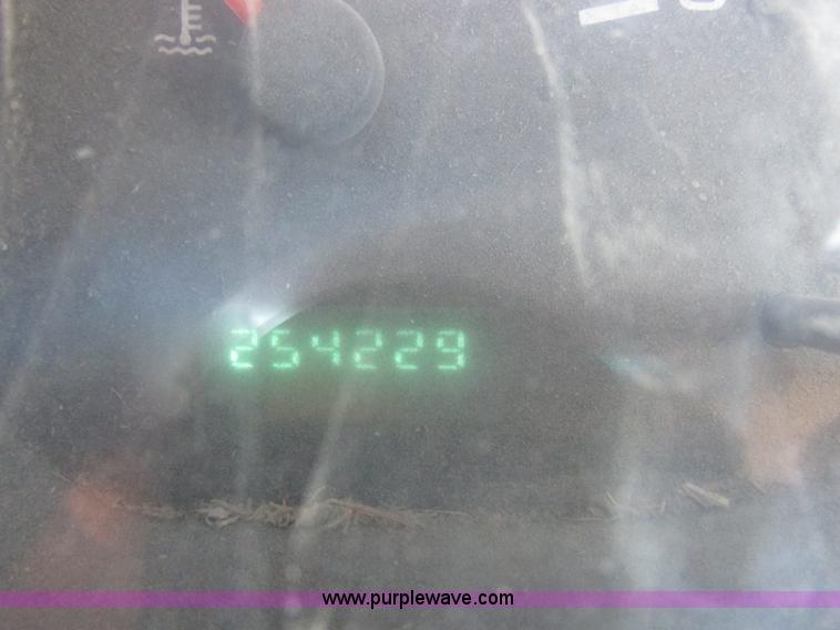 image for item K2231 2001 Dodge Ram 3500 Quad Cab flatbed pickup truck