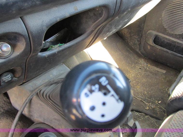 image for item K2231 2001 Dodge Ram 3500 Quad Cab flatbed pickup truck