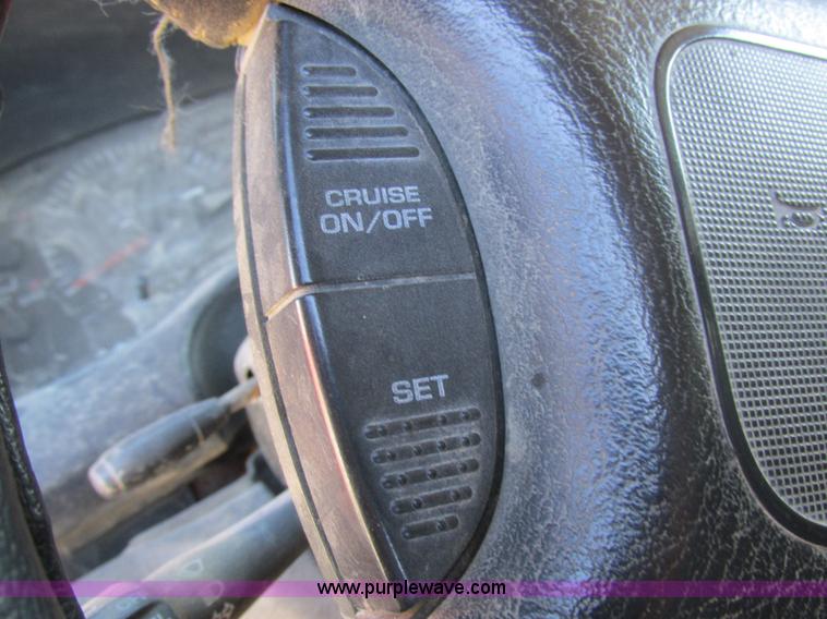 image for item K2231 2001 Dodge Ram 3500 Quad Cab flatbed pickup truck