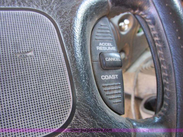 image for item K2231 2001 Dodge Ram 3500 Quad Cab flatbed pickup truck