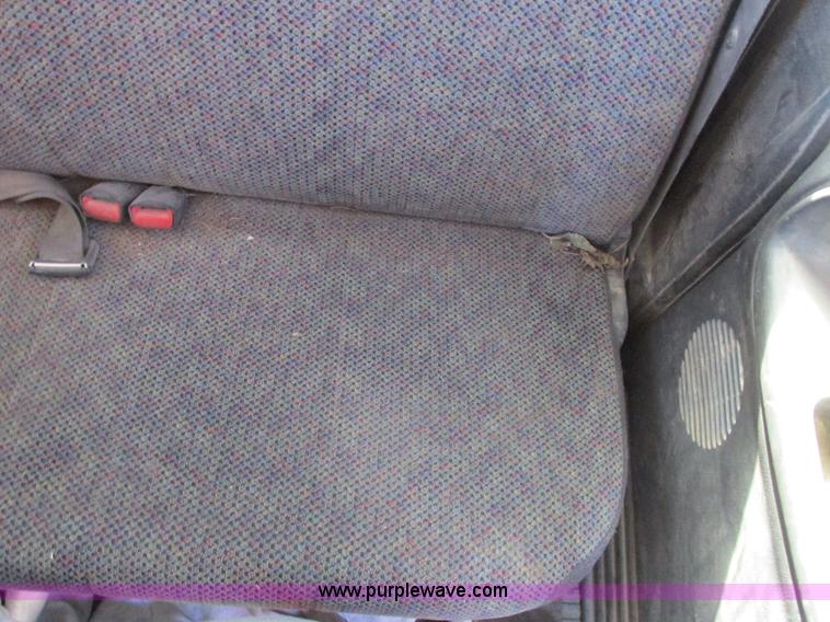 image for item K2231 2001 Dodge Ram 3500 Quad Cab flatbed pickup truck