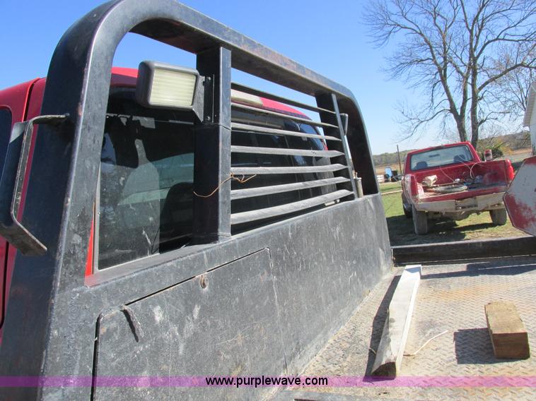 image for item K2231 2001 Dodge Ram 3500 Quad Cab flatbed pickup truck
