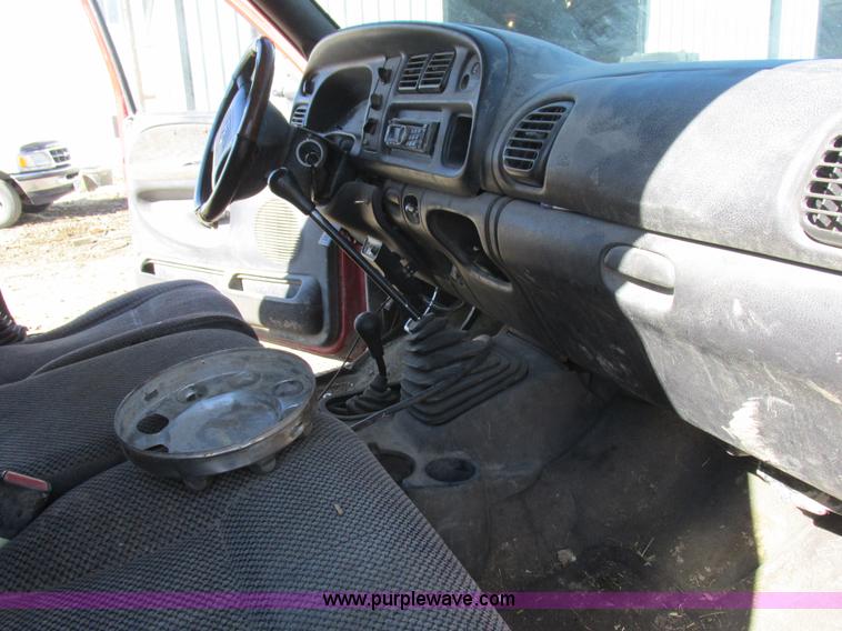 image for item K2231 2001 Dodge Ram 3500 Quad Cab flatbed pickup truck