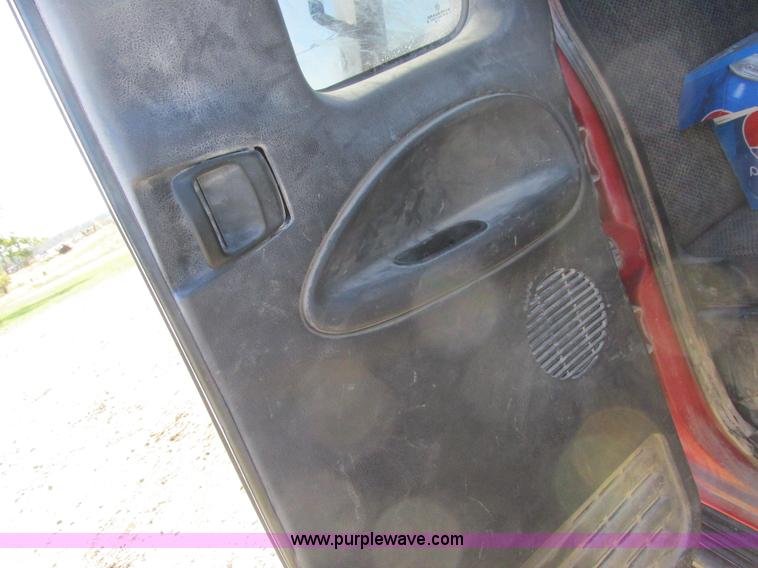 image for item K2231 2001 Dodge Ram 3500 Quad Cab flatbed pickup truck