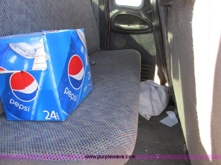 image for item K2231 2001 Dodge Ram 3500 Quad Cab flatbed pickup truck