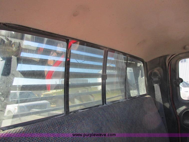 image for item K2231 2001 Dodge Ram 3500 Quad Cab flatbed pickup truck