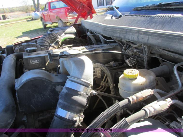 image for item K2231 2001 Dodge Ram 3500 Quad Cab flatbed pickup truck