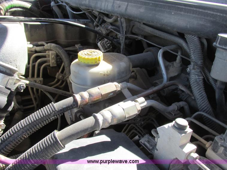 image for item K2231 2001 Dodge Ram 3500 Quad Cab flatbed pickup truck