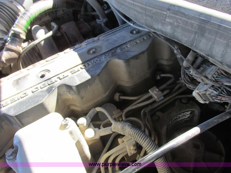 image for item K2231 2001 Dodge Ram 3500 Quad Cab flatbed pickup truck