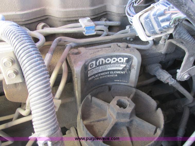 image for item K2231 2001 Dodge Ram 3500 Quad Cab flatbed pickup truck