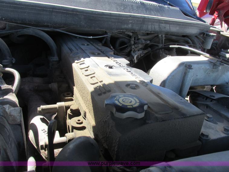 image for item K2231 2001 Dodge Ram 3500 Quad Cab flatbed pickup truck