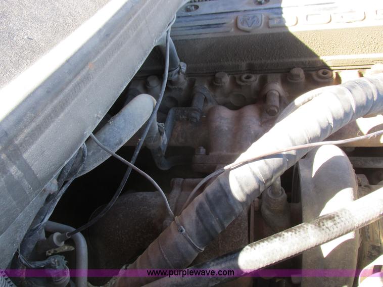 image for item K2231 2001 Dodge Ram 3500 Quad Cab flatbed pickup truck