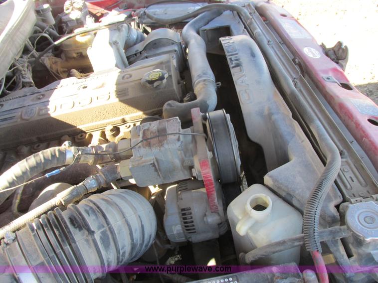 image for item K2231 2001 Dodge Ram 3500 Quad Cab flatbed pickup truck