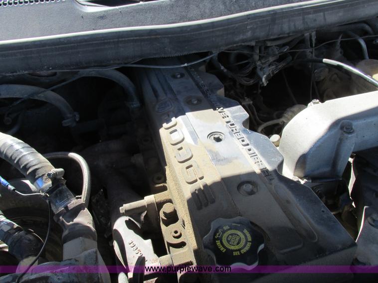 image for item K2231 2001 Dodge Ram 3500 Quad Cab flatbed pickup truck