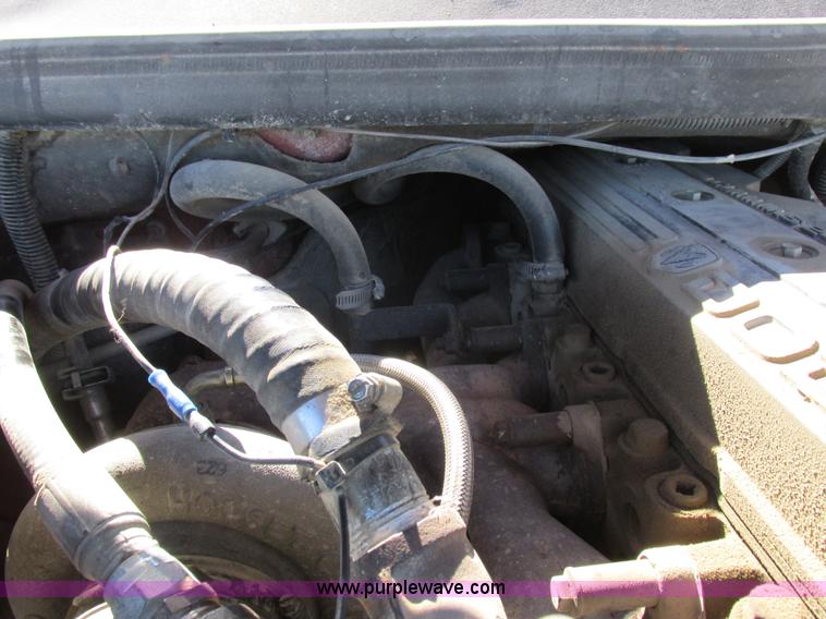 image for item K2231 2001 Dodge Ram 3500 Quad Cab flatbed pickup truck