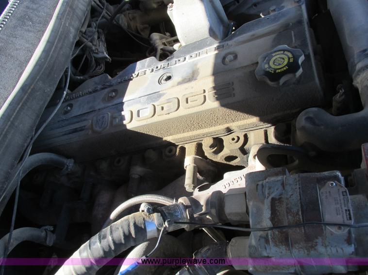 image for item K2231 2001 Dodge Ram 3500 Quad Cab flatbed pickup truck