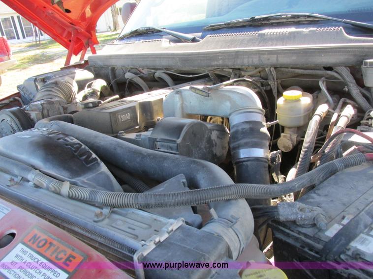 image for item K2231 2001 Dodge Ram 3500 Quad Cab flatbed pickup truck