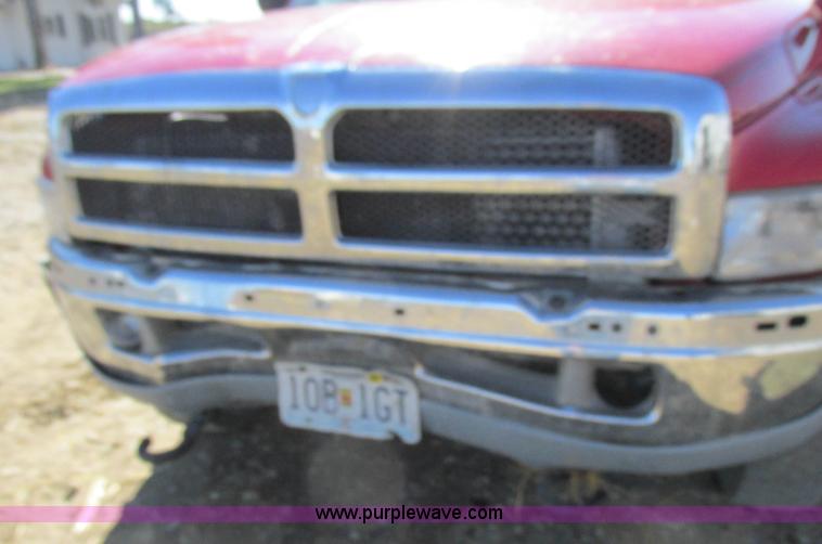 image for item K2231 2001 Dodge Ram 3500 Quad Cab flatbed pickup truck