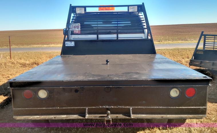 image for item L6033 2001 Dodge Ram 3500 Quad Cab flatbed pickup truck