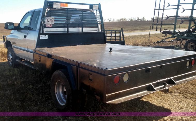 image for item L6033 2001 Dodge Ram 3500 Quad Cab flatbed pickup truck