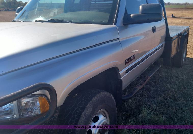 image for item L6033 2001 Dodge Ram 3500 Quad Cab flatbed pickup truck