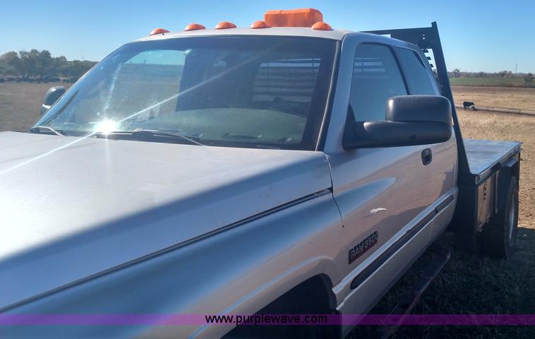 image for item L6033 2001 Dodge Ram 3500 Quad Cab flatbed pickup truck