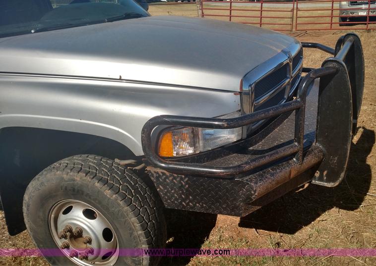 image for item L6033 2001 Dodge Ram 3500 Quad Cab flatbed pickup truck
