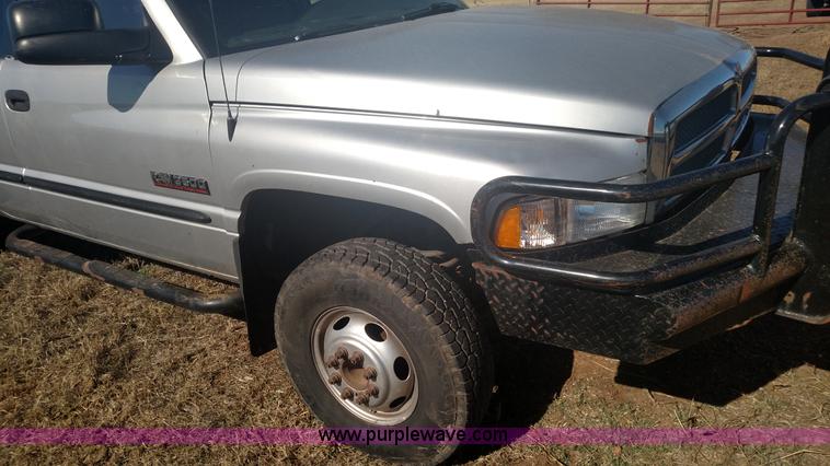 image for item L6033 2001 Dodge Ram 3500 Quad Cab flatbed pickup truck