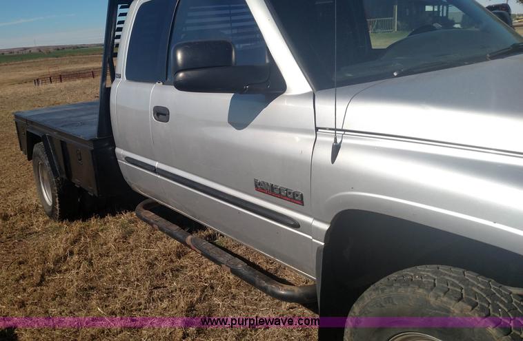 image for item L6033 2001 Dodge Ram 3500 Quad Cab flatbed pickup truck