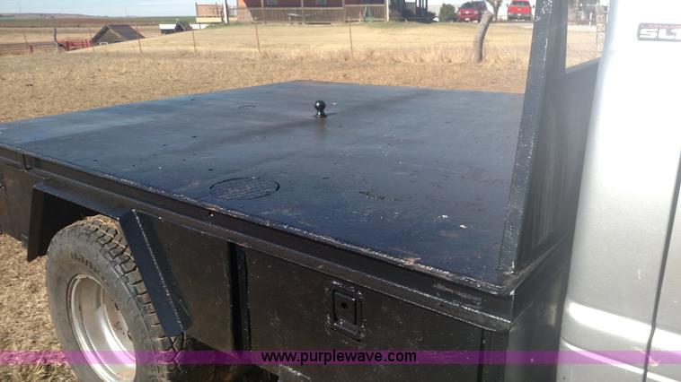 image for item L6033 2001 Dodge Ram 3500 Quad Cab flatbed pickup truck