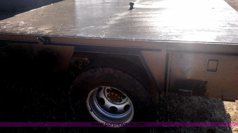 image for item L6033 2001 Dodge Ram 3500 Quad Cab flatbed pickup truck