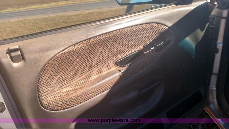 image for item L6033 2001 Dodge Ram 3500 Quad Cab flatbed pickup truck