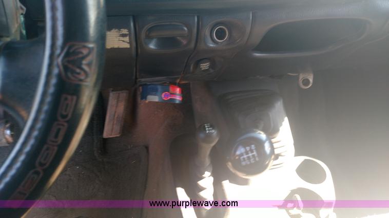 image for item L6033 2001 Dodge Ram 3500 Quad Cab flatbed pickup truck