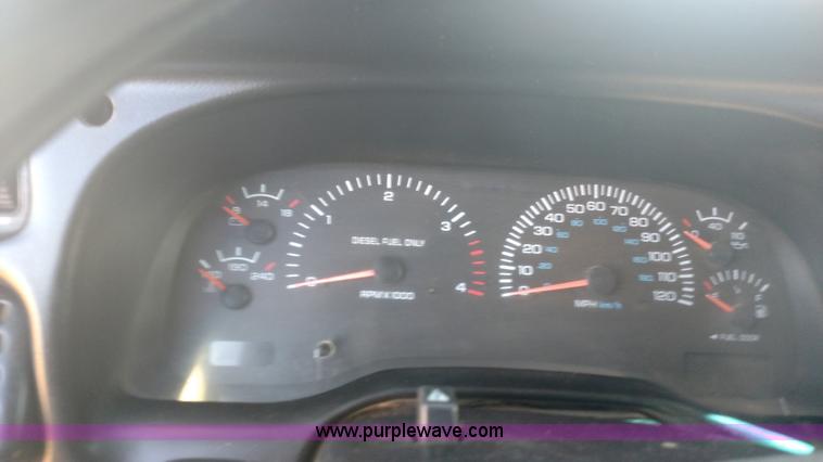 image for item L6033 2001 Dodge Ram 3500 Quad Cab flatbed pickup truck