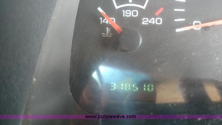 image for item L6033 2001 Dodge Ram 3500 Quad Cab flatbed pickup truck