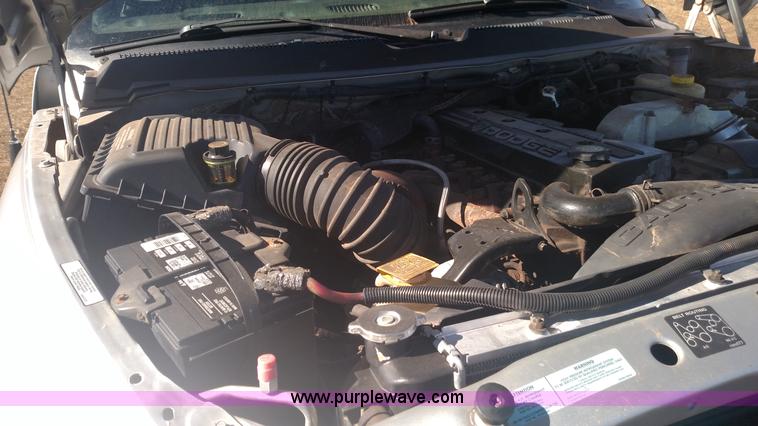 image for item L6033 2001 Dodge Ram 3500 Quad Cab flatbed pickup truck