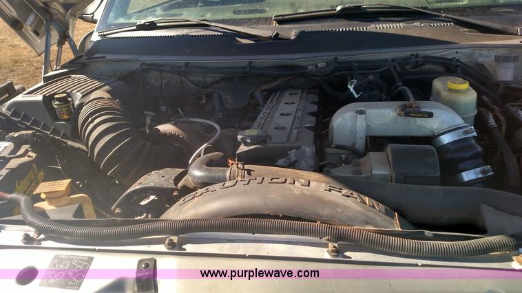 image for item L6033 2001 Dodge Ram 3500 Quad Cab flatbed pickup truck