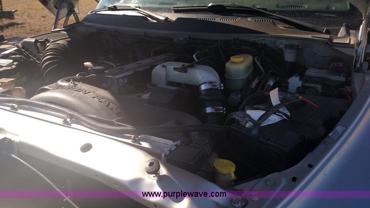 image for item L6033 2001 Dodge Ram 3500 Quad Cab flatbed pickup truck