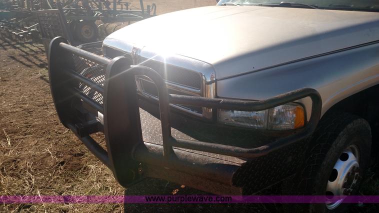 image for item L6033 2001 Dodge Ram 3500 Quad Cab flatbed pickup truck