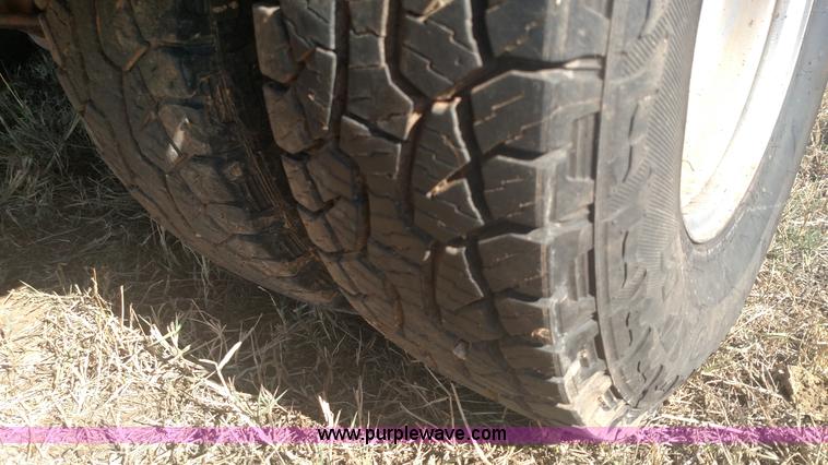 image for item L6033 2001 Dodge Ram 3500 Quad Cab flatbed pickup truck