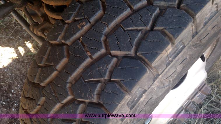 image for item L6033 2001 Dodge Ram 3500 Quad Cab flatbed pickup truck