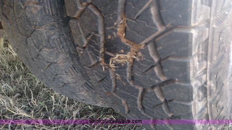 image for item L6033 2001 Dodge Ram 3500 Quad Cab flatbed pickup truck