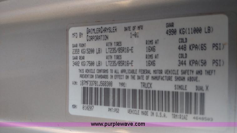 image for item L6033 2001 Dodge Ram 3500 Quad Cab flatbed pickup truck