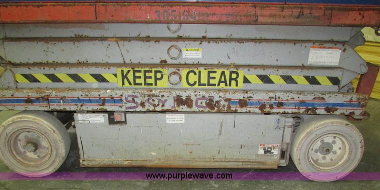 image for item H1030 1999 Skyjack SJIII 3220 scissor lift