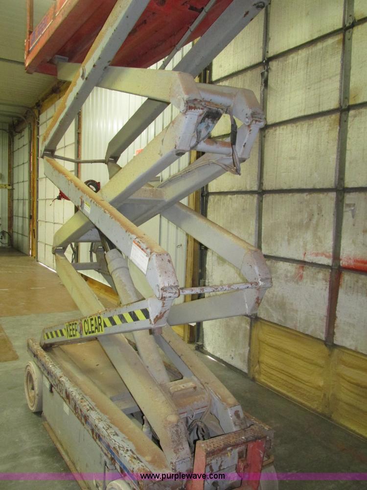image for item H1030 1999 Skyjack SJIII 3220 scissor lift
