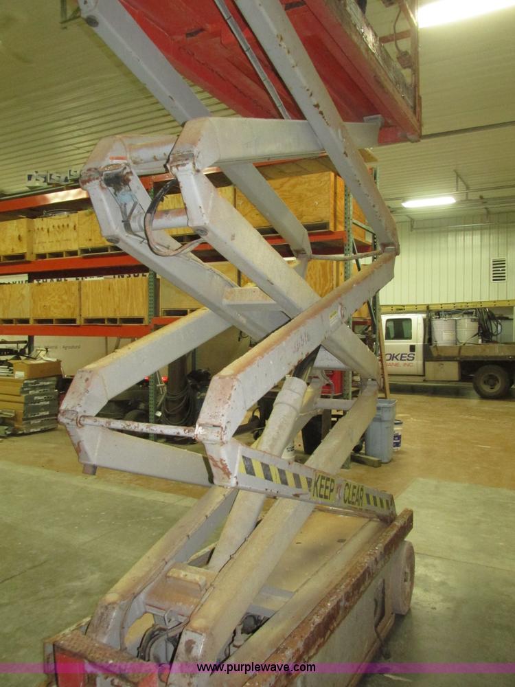 image for item H1030 1999 Skyjack SJIII 3220 scissor lift