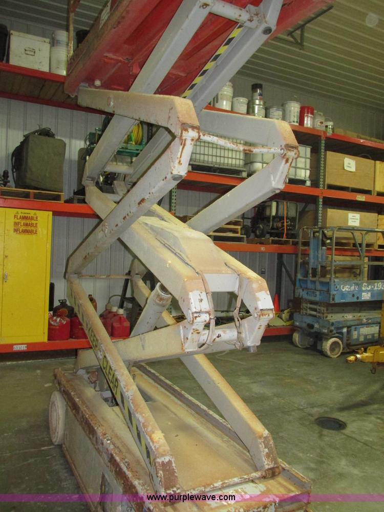 image for item H1030 1999 Skyjack SJIII 3220 scissor lift