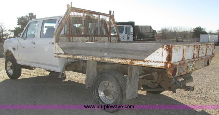 image for item H1032 1996 Ford F350 XLT Crew Cab flat dump bed truck