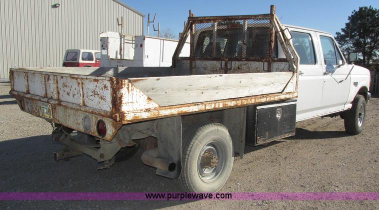 image for item H1032 1996 Ford F350 XLT Crew Cab flat dump bed truck