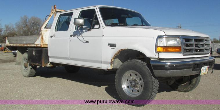 image for item H1032 1996 Ford F350 XLT Crew Cab flat dump bed truck